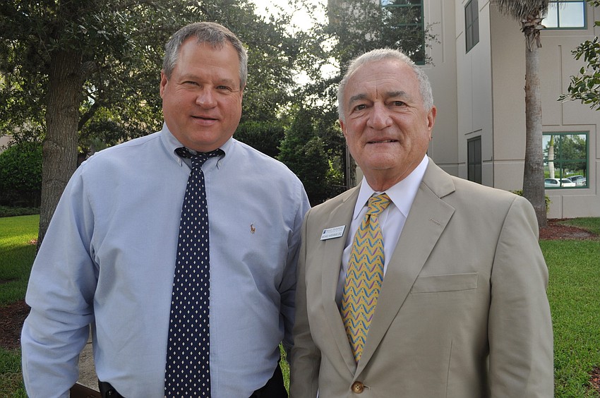 Geoff Nichols, an attorney, with Michael Harshman of Najmy Thompson