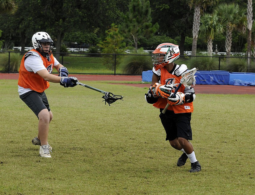 ODA freshman defender Brad Hansell attempts to block St. Stephenâ€™s seventh-grader TJ McNeil during a shooting drill.
