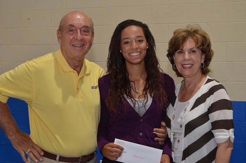 Dick and Lorraine Vitale present 18-year-old North Port graduate Makayla Francis with a $1,000 scholarship.