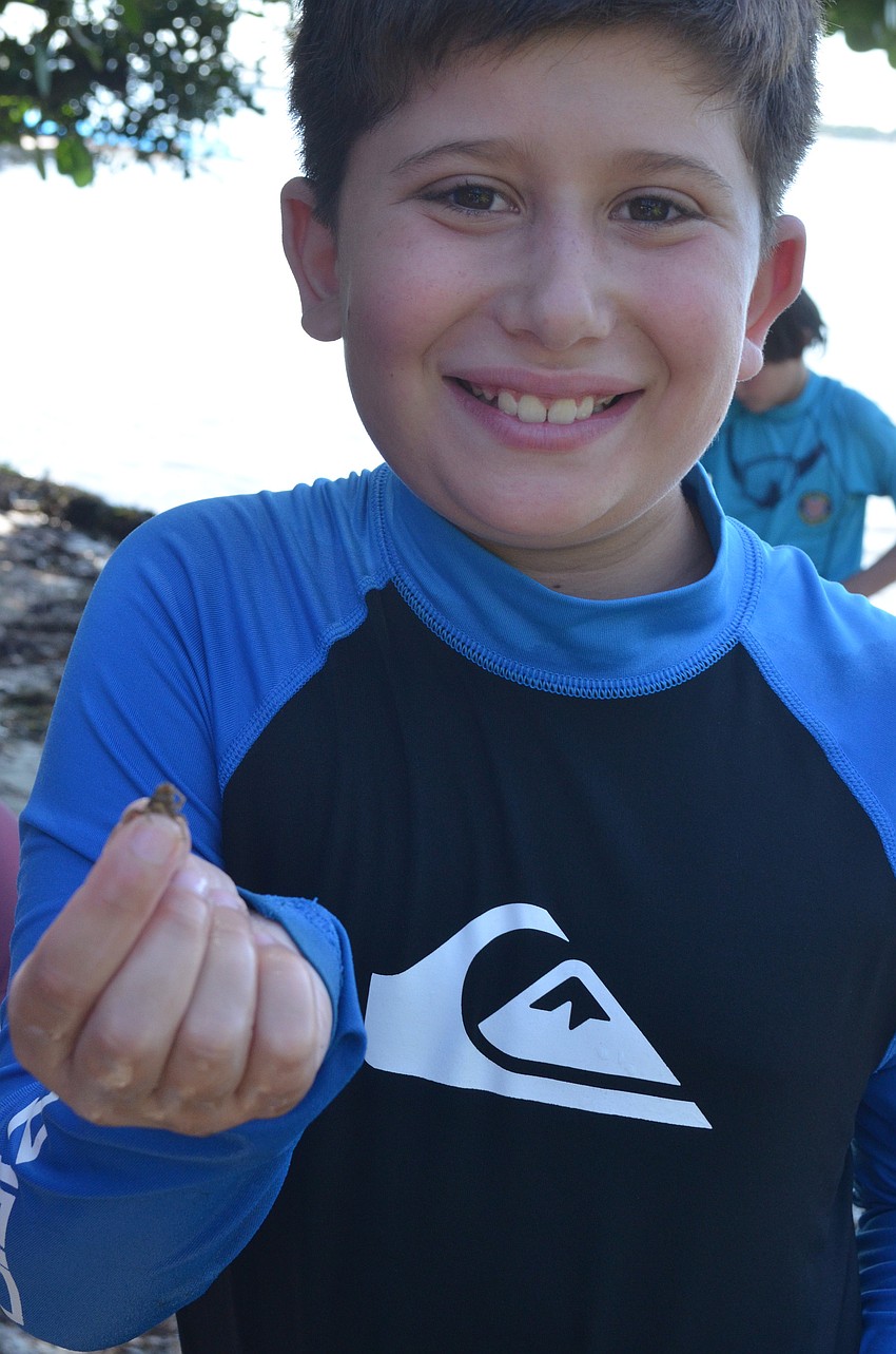Russell Kramer, 10, caught a tiny crab.