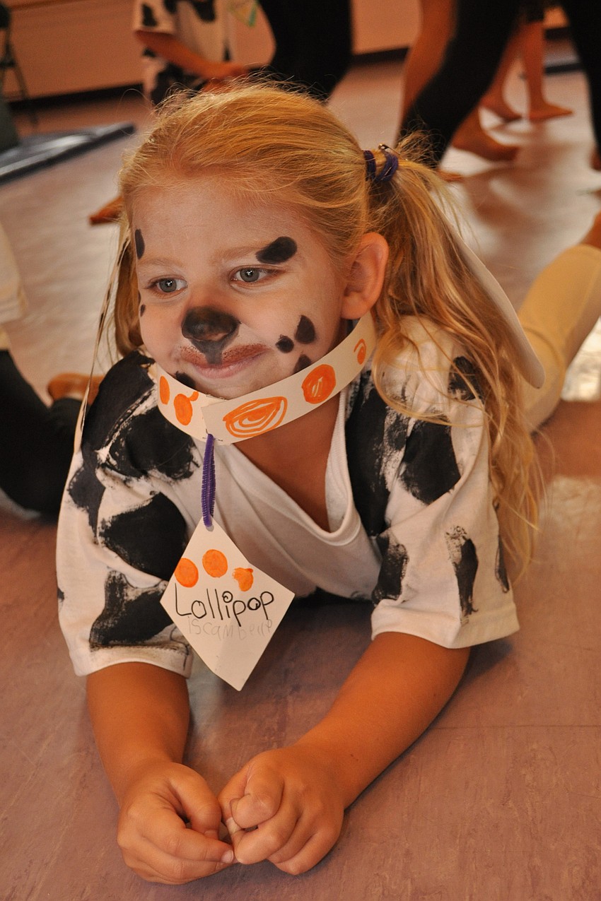 Camille Anders, 6, as Lollipop, watches television.