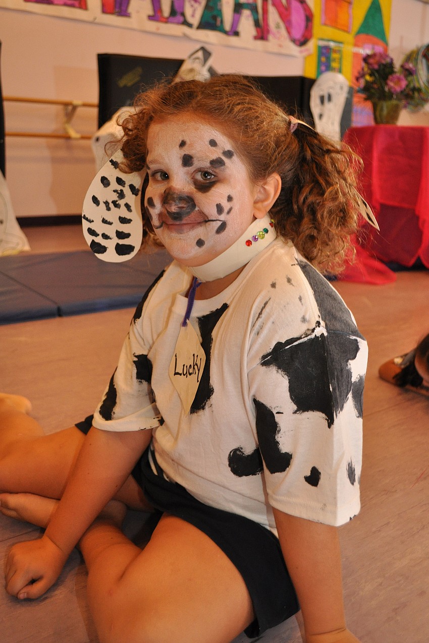 A puppy, portrayed by Casey Fults, watches television.