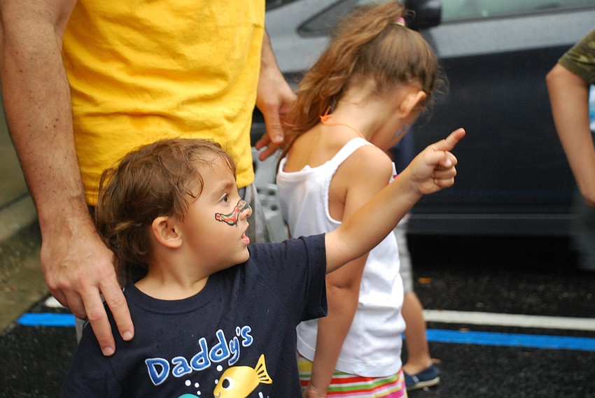 An ice cream truck handed out free ice cream. Luca Schlosberg chose a Teenage Mutant Ninja Turtle popsicle.