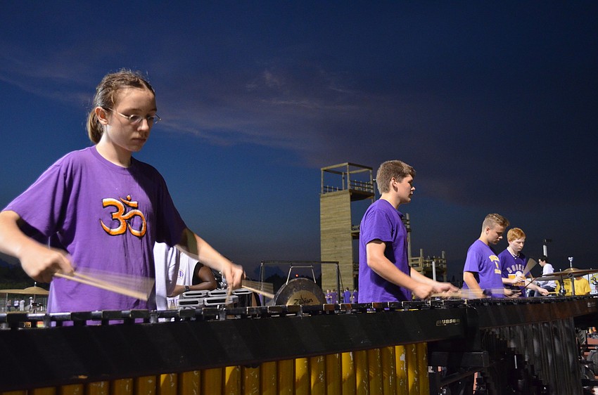 Booker High School junior Julien Rothe practices before the half time show.