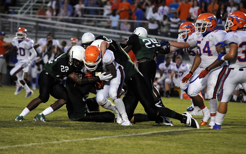 The Lakewood Ranch defense stops Southeast running back Courtney Allen for a short gain.