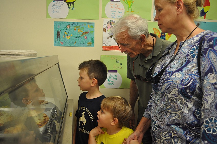 Jackson and Dylan McCloud pick out their lunch with grandparents Bill and Becky Oâ€™Neil.