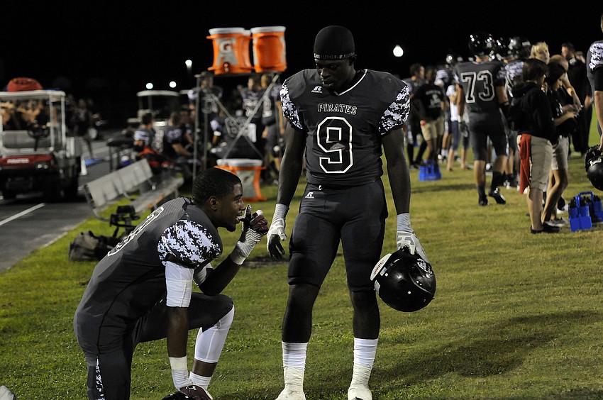 Braden River wide receiver Andre Mays and running back Titus Humphrey discuss the game plan on the sidelines.