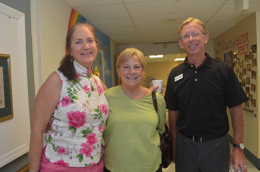 Wendy Webb of ServPro of Bradenton, Gail Loefgren of the Longboat Key Chamber of Commerce and Greg Hayes of Higher Standards