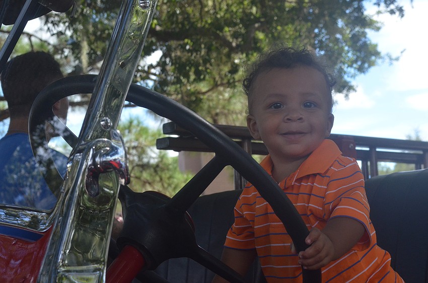 Jackson Smith, 1, plays on an old fire truck.