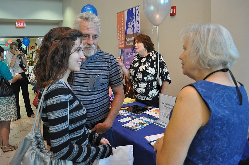 Patricia Lidell and her father, David, chatted with Barry Puett, the department chair of social and behavior science.