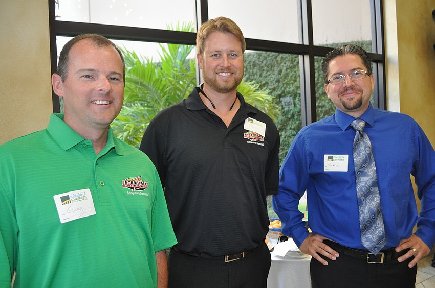 Greg Read and Damon Gilliland of Interstate Batteries with Tim Kulig, who is self employed