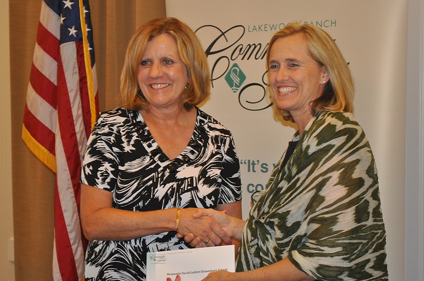 Monica Rice, a guidance counselor at B.D. Gullett Elementary School, accepted a grant from Jennifer Schembri of the Lakewood Ranch Community Fund.