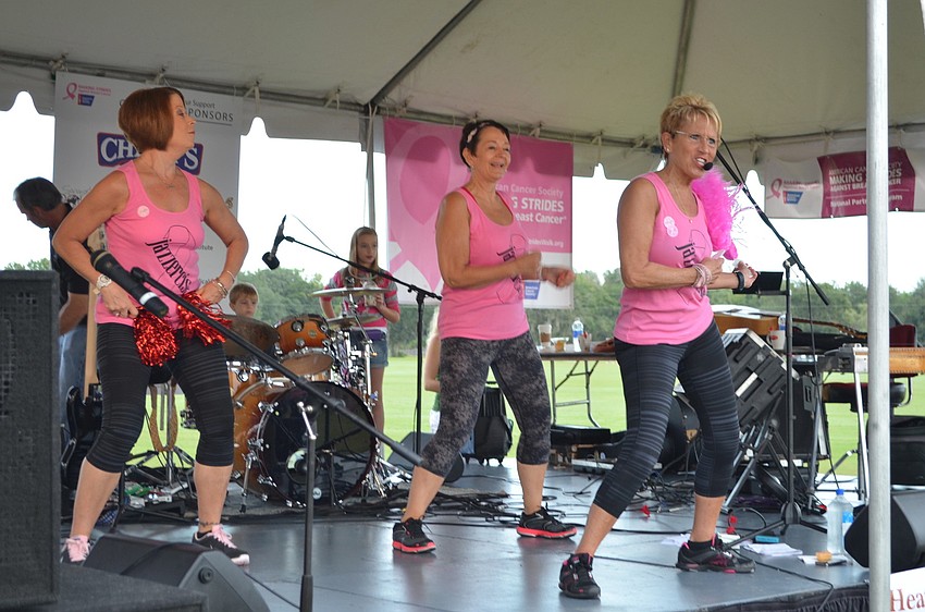 The ladies from Jazzercise lead the walkers in a stretch.