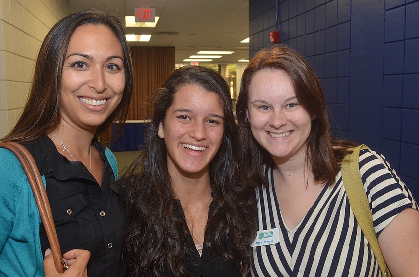 Suriya Khong with Community Youth Development, Pine View senior Vanessa Rodriguez and Megan Wenger of Community Youth Development come to speak with Mayor Shanon Snyder.