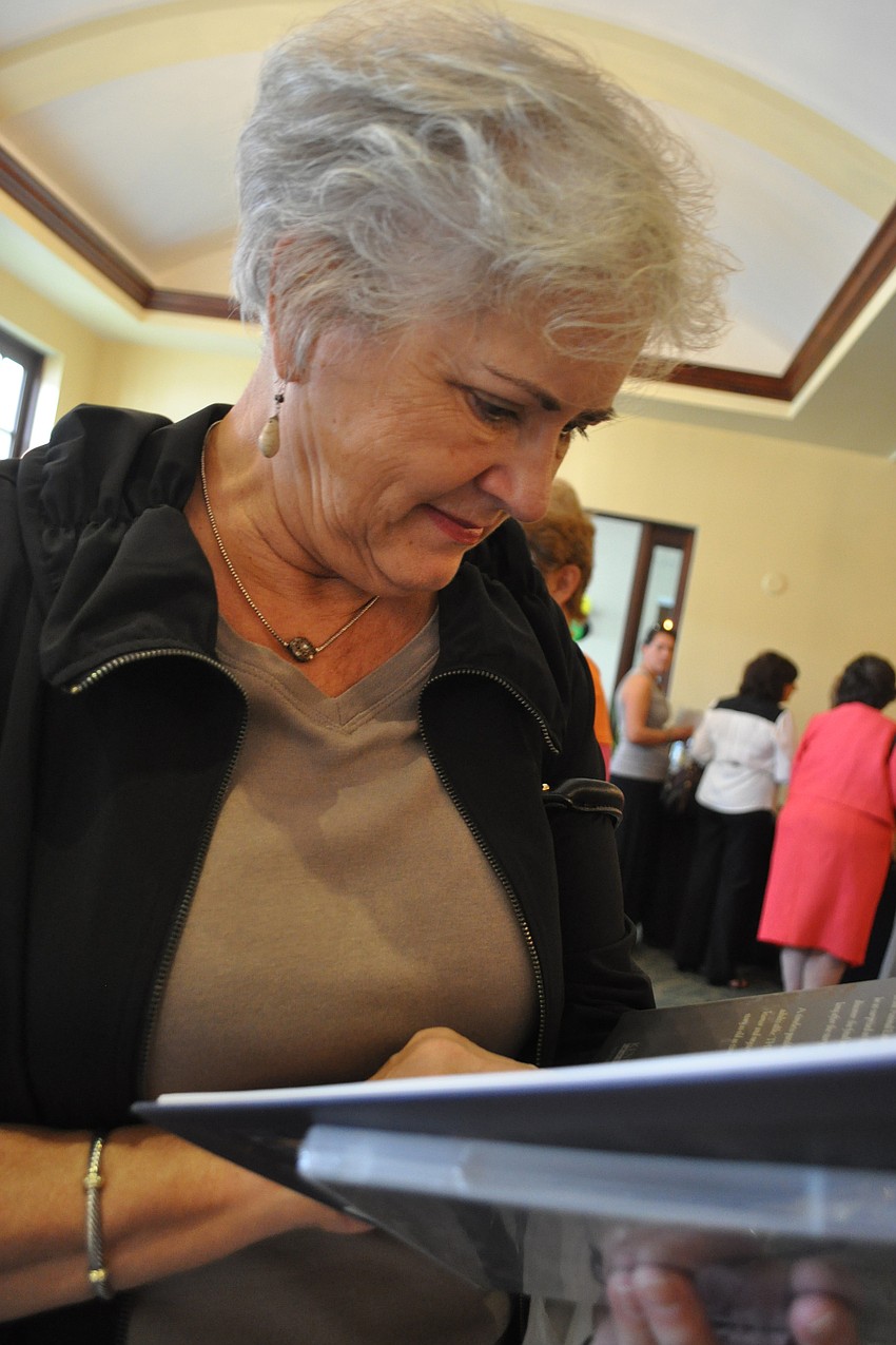 Myra Buff looked at a book titled â€œThe Giant Leafâ€ for her granddaughters.