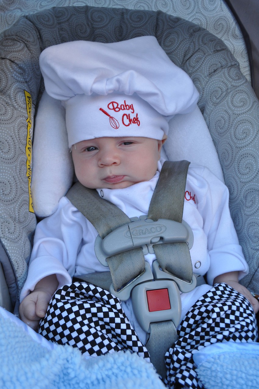 Lyndsy McDonald, former owner of Pastries by Design, brought her newborn, Evan, dressed as a chef.