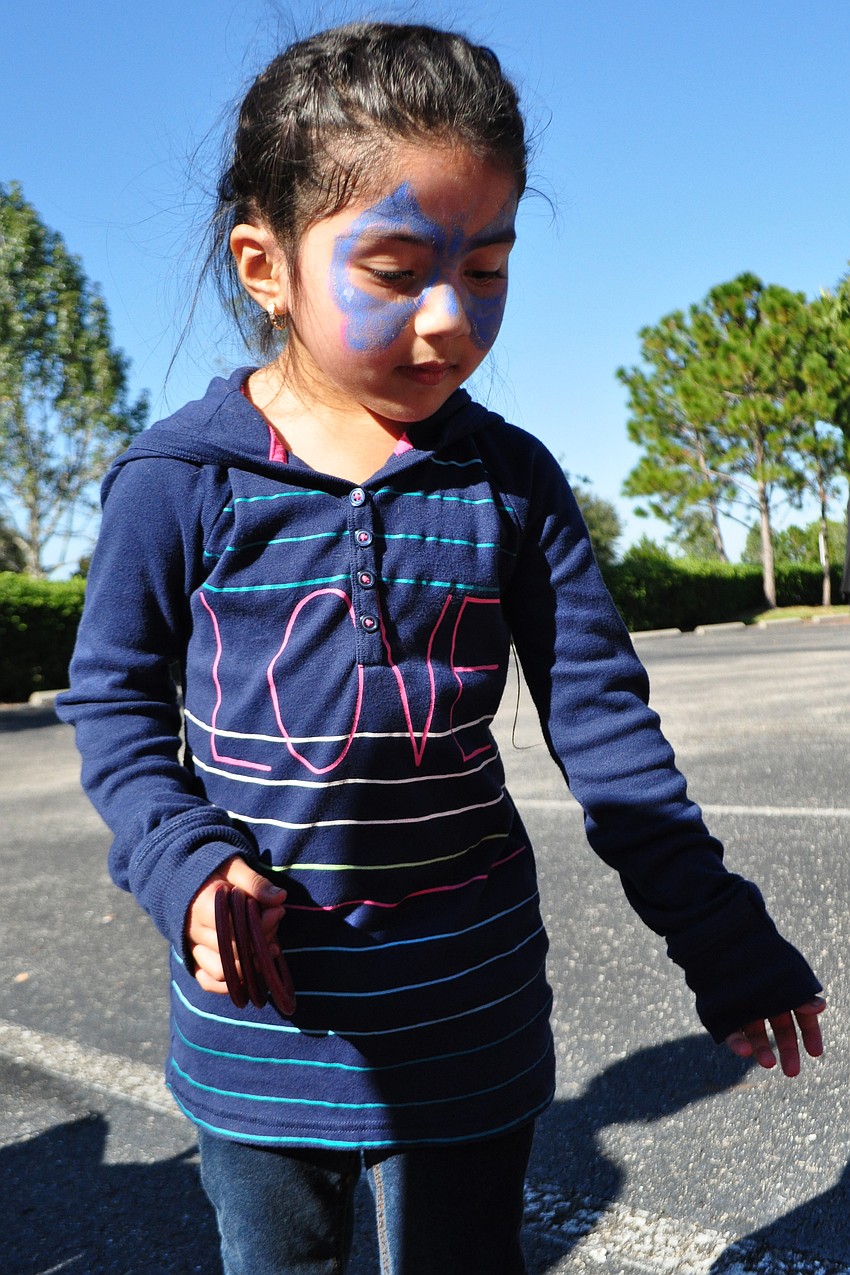 Gabriela Sandoval, 4, tried her hand at a game of ring toss.