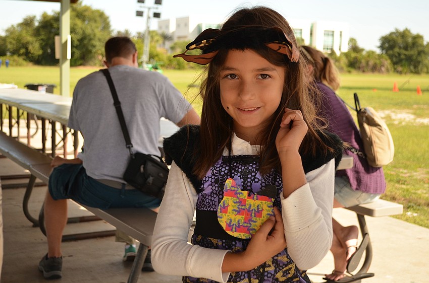 Destiny Talbert with the magic scratch she made at the craft table.