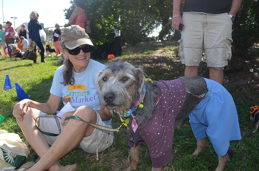 Punker Myra and her owner Chris Wallace sit in the shade
