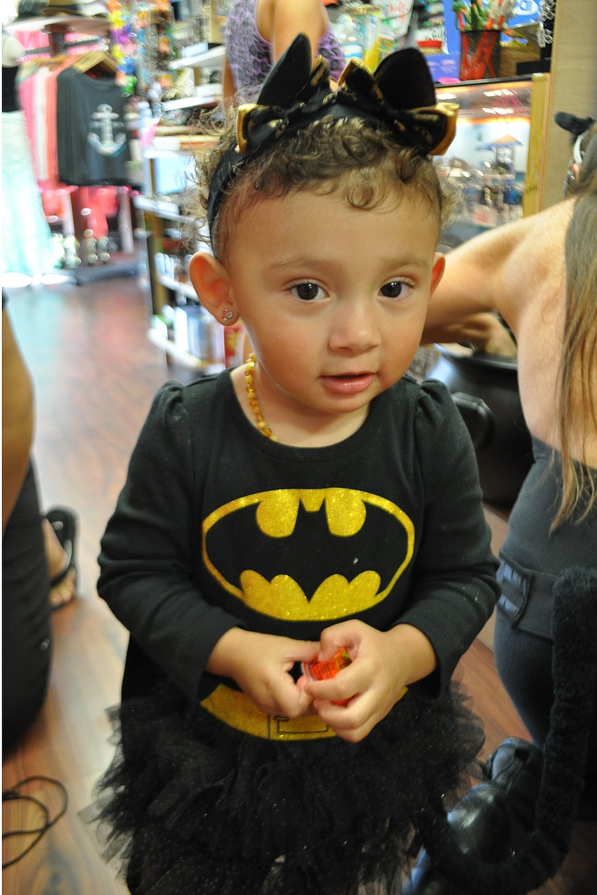 Izabella Lazar, 2, holds her sweet treats.
