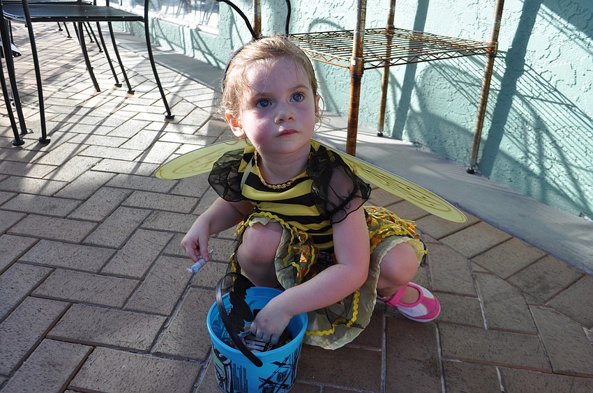 Lochlyn Abernathy,  2, picks out her favorite piece of candy.