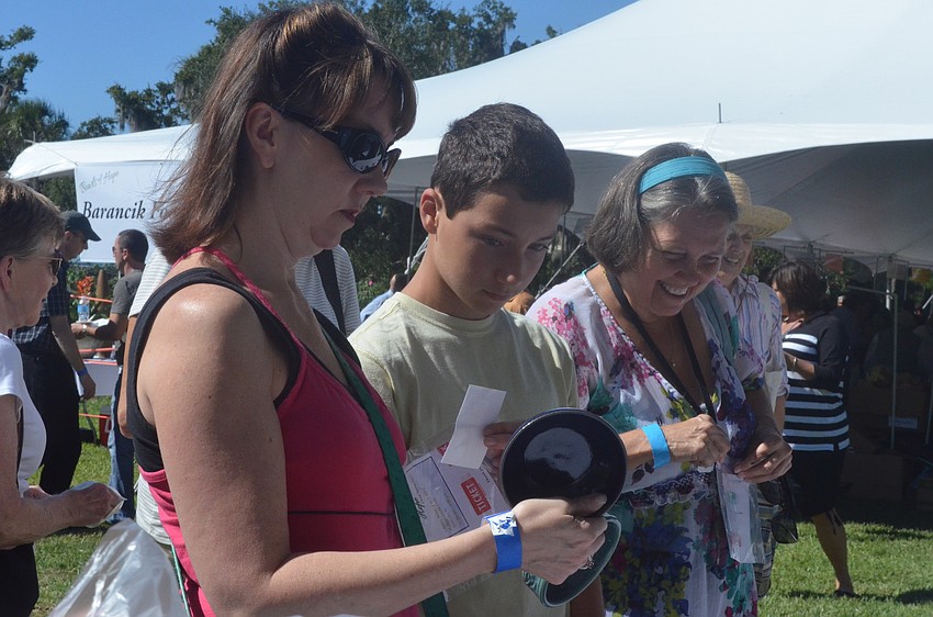 Cindy and Antonio Urbano choose their bowls