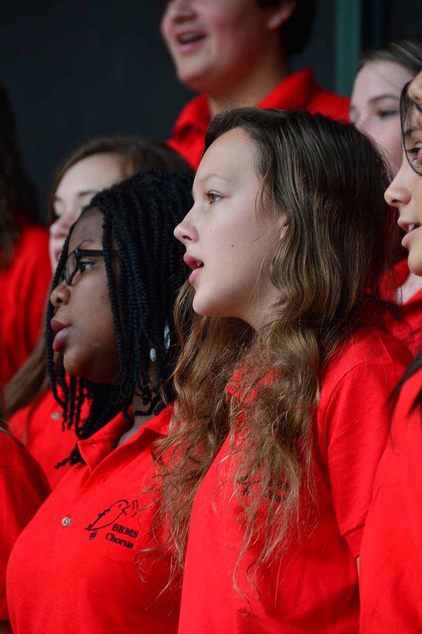 Widemir Saint-Juste and Diana Kovalenko, seventh-grade students, performed with the choir.