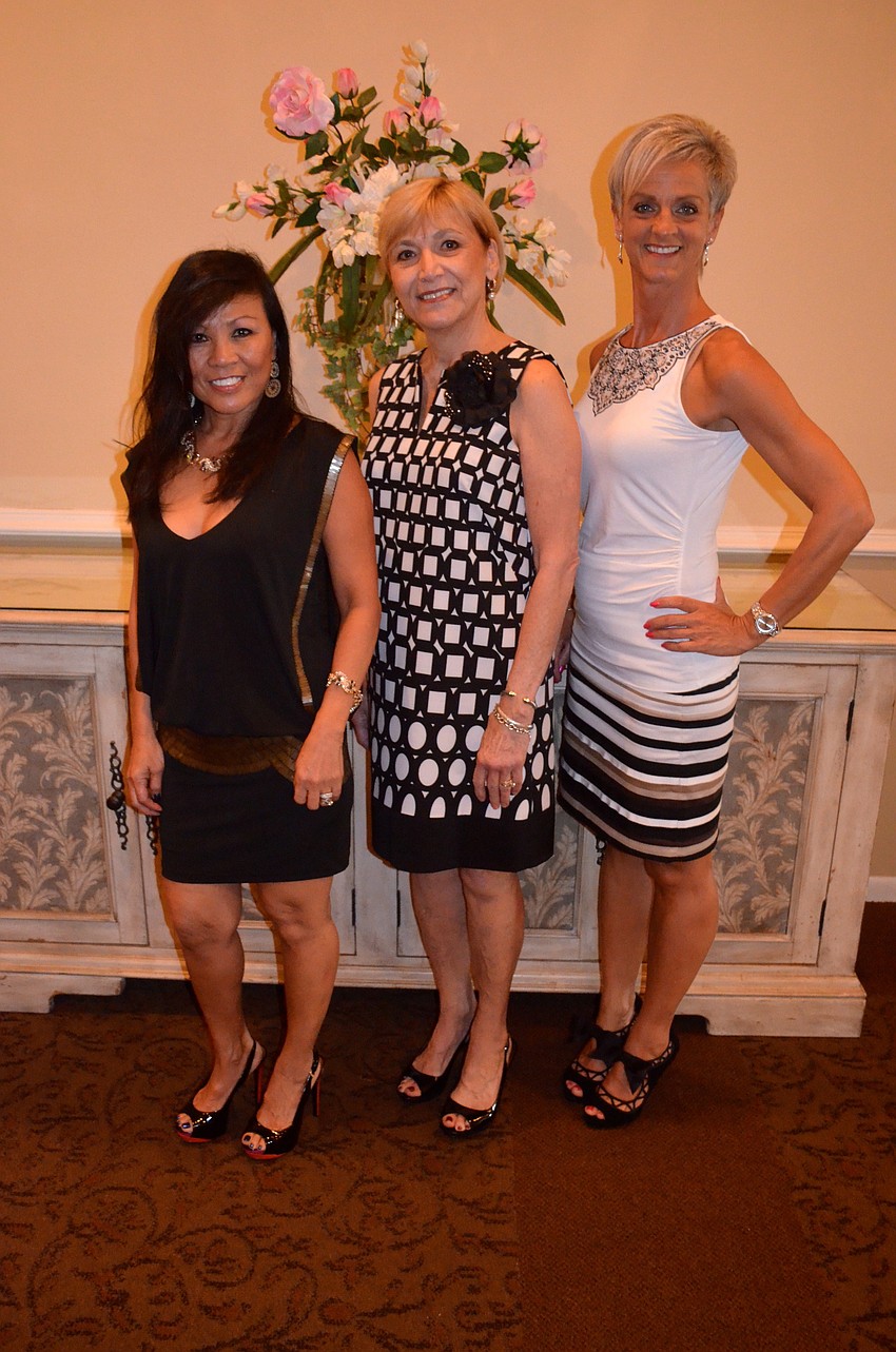 Fashion show models Syd Buck, Peggy Fainelli and Jo Gaden show off their pre-runway outfits.