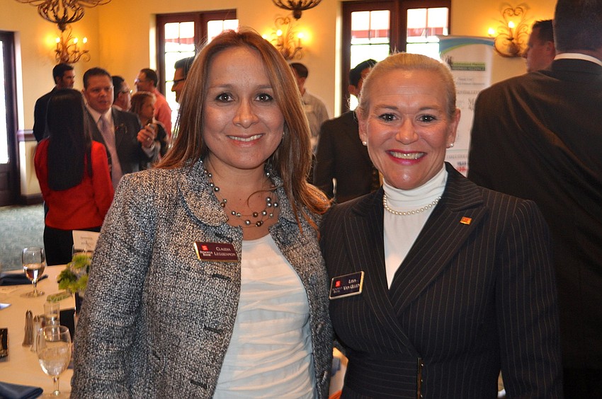 Claudia Leguizamon and Lisa Van Ullen network with other members during the Sandies.