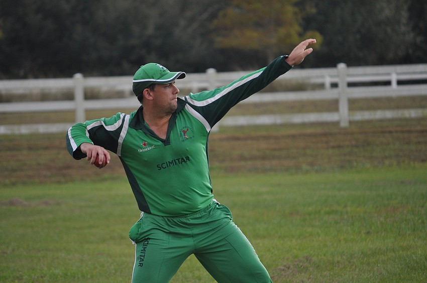 A Cayman Islandsâ€™ fielder prepared to throw the ball.