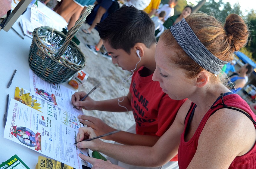 Michele and Matthew Reisdorf sign up for the race.