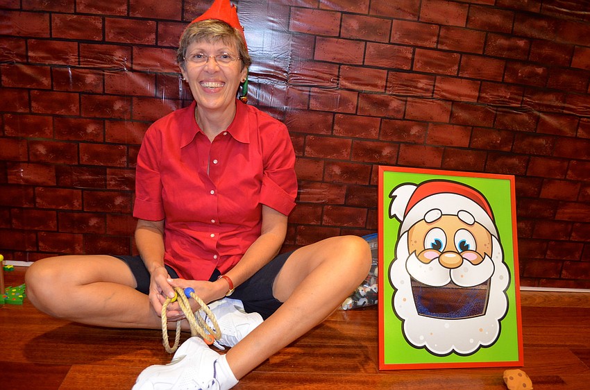 Karen Koch runs the feed Santa cookies toss.