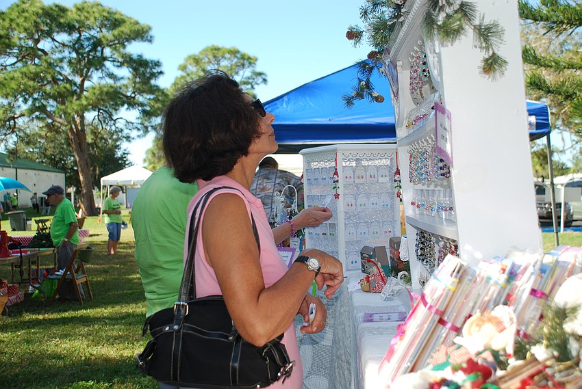 Linda Gordon looks through jewelry