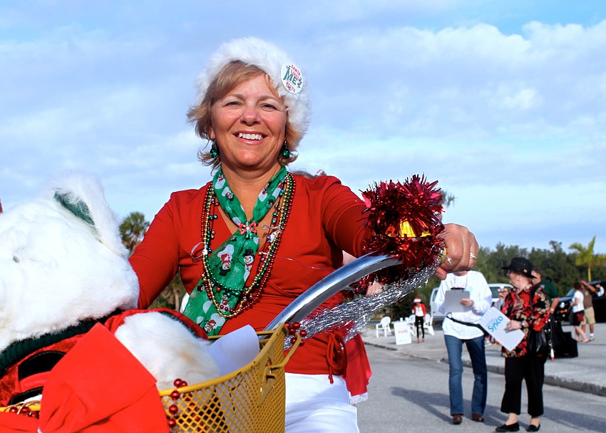 Carol Kagi rides her decorated bike as part of the parade.