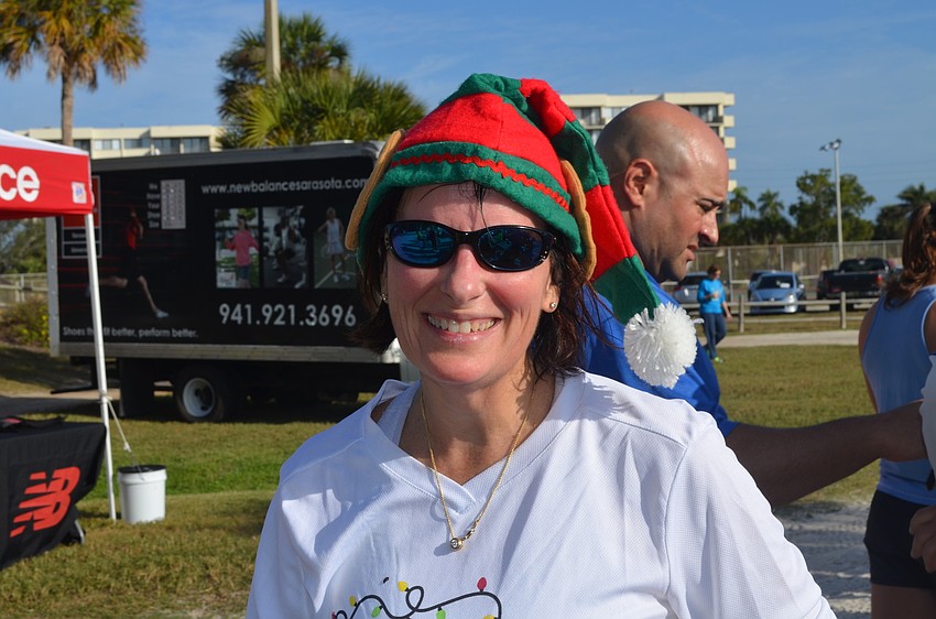 Patti Carpenter wears a festive hat.