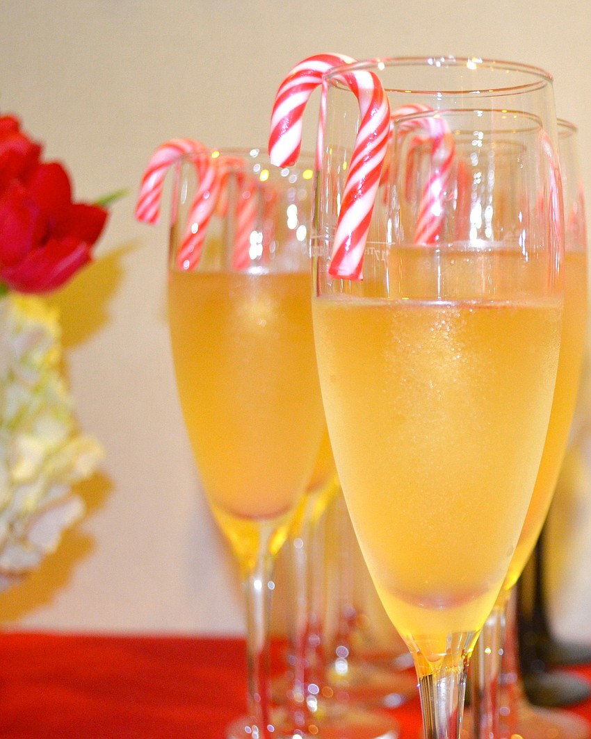 Glasses of champagne with festive candy canes were available to attendees at the door.