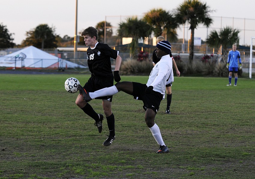 Braden Riverâ€™s Mitchell McCormick and Lakewood Ranchâ€™s Schmid Payen battle for possession in the first half of the Mustangs 1-0 victory over the Pirates Jan. 7.