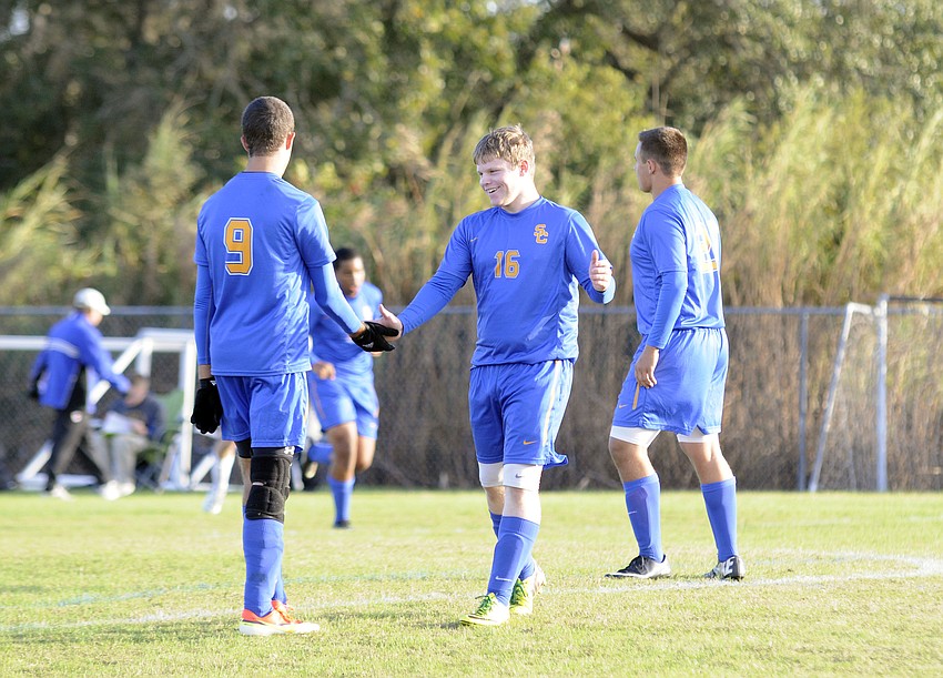 Sarasota Christianâ€™s Lane Chupp and Brady Weaver celebrate following a Blazers goal in the first half.