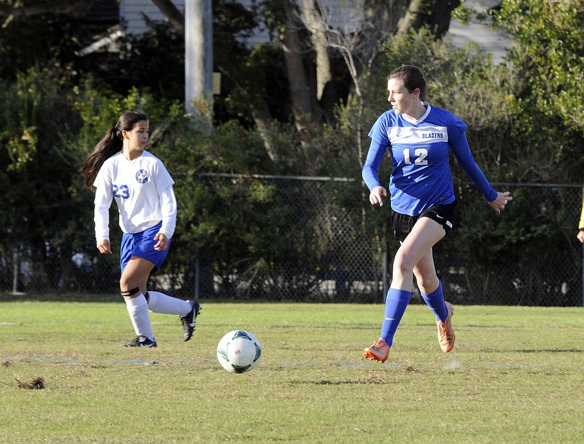Sarasota Christianâ€™s Kelsey Murphy maintains possession for the Lady Blazers.