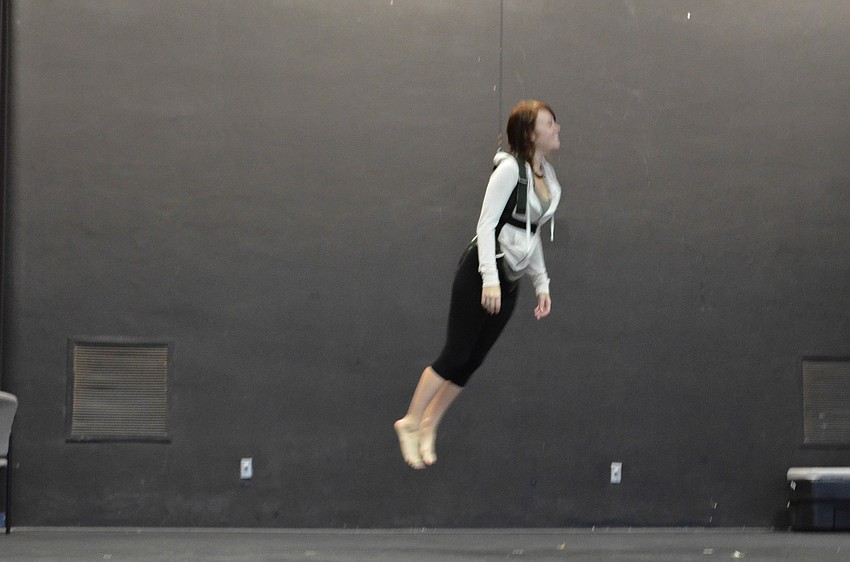 Gretchen Beaumier tests her flying harness