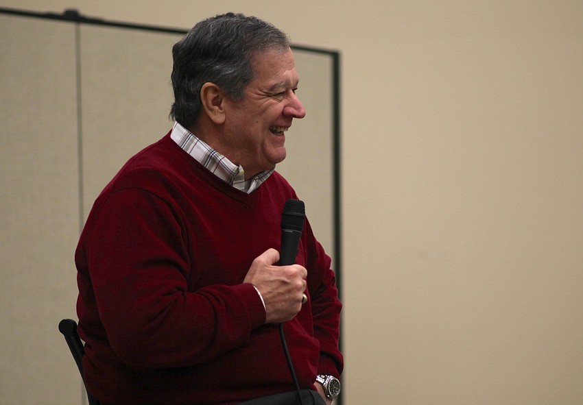 After a story about Miles Leavitt, H. Terrell Griffin laughs with the crowd.