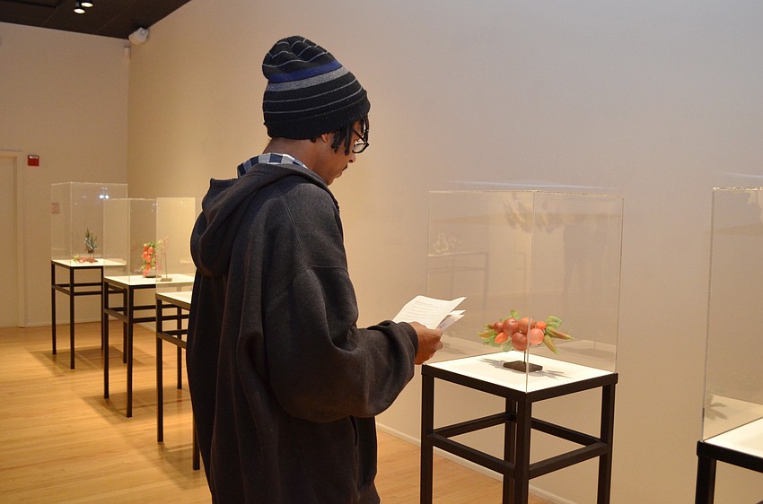 Ringling student Adrian Harris tours the â€œGlass and Charcoalâ€ exhibition