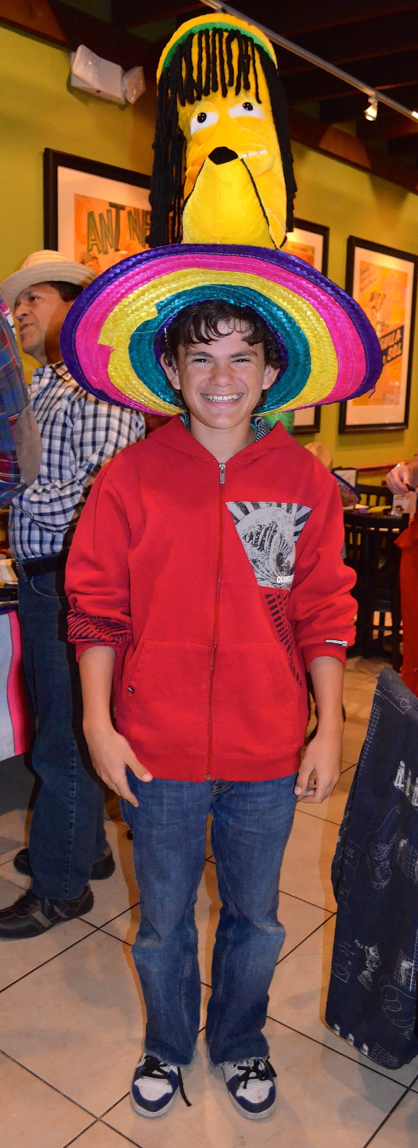 Levi Waxler, 13, models the tallest hat in the room.