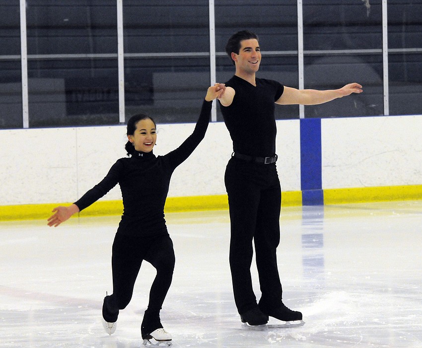 U.S. figure skaters Felicia Zhang and Nathan Bartholomay receive a round of applause from fans during an open training session Jan. 22, at the Ellenton Ice and Sports Complex.