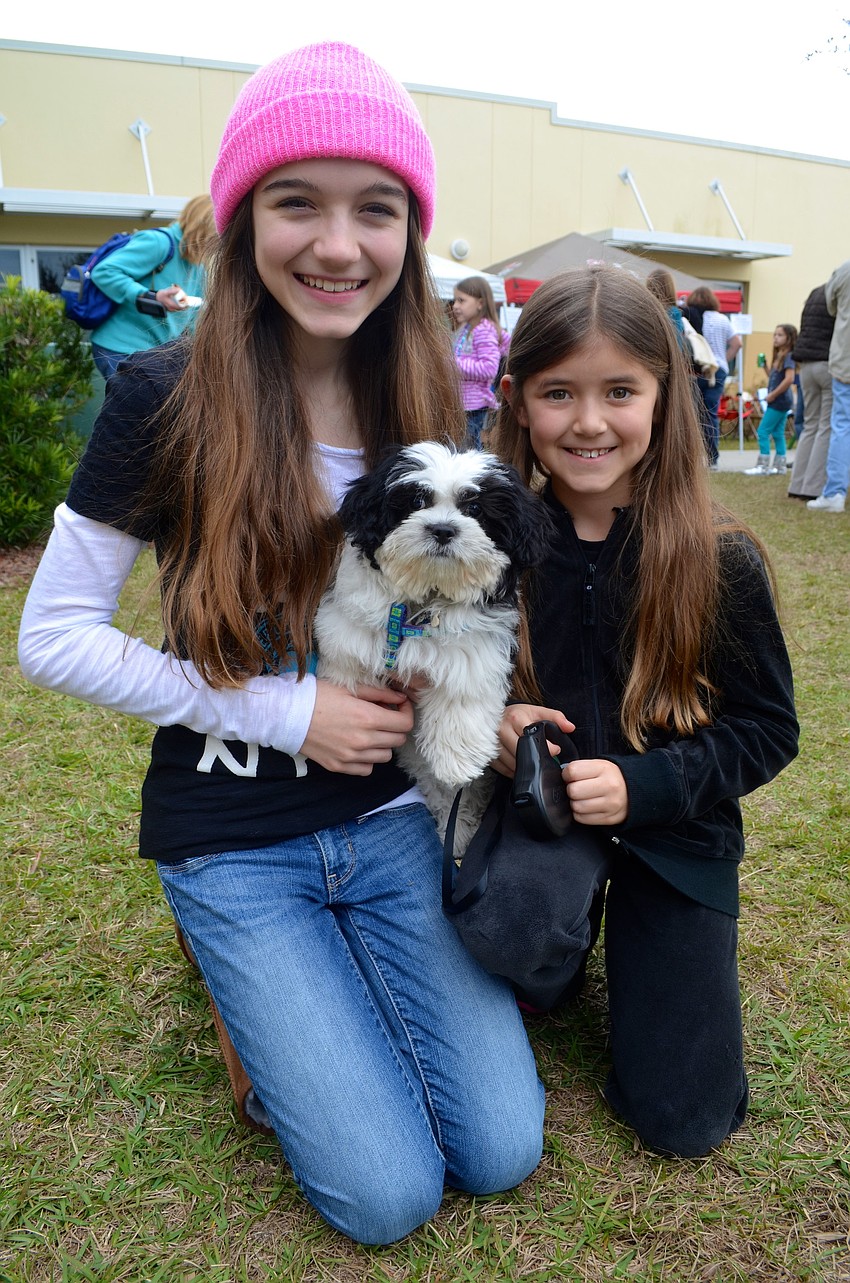 The Patterson sisters â€” Jade, 12, and Jordyn, 9 â€” with their new puppy, Jewel.