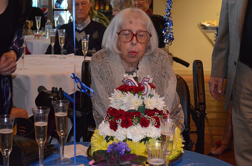 Charlotte Zwick blows out her cake's candles.