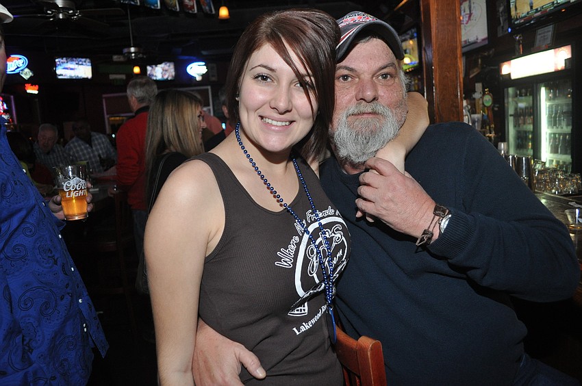 Nina Schrum, an Edâ€™s Tavern waitress, with John Garofalo, who sits in the same spot at the bar every day.