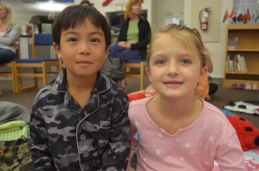 Oliver Brum, 8, and Chloe Niebuhr, 7, both want to write a story about their favorite Disney characters.