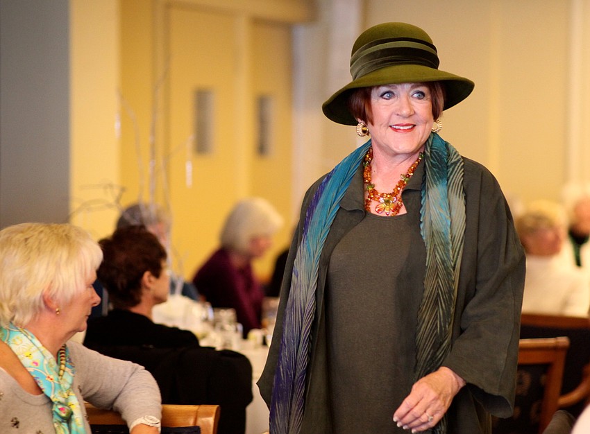 Rebecca Taylor wears a hat to go along with her scarf and jacket.