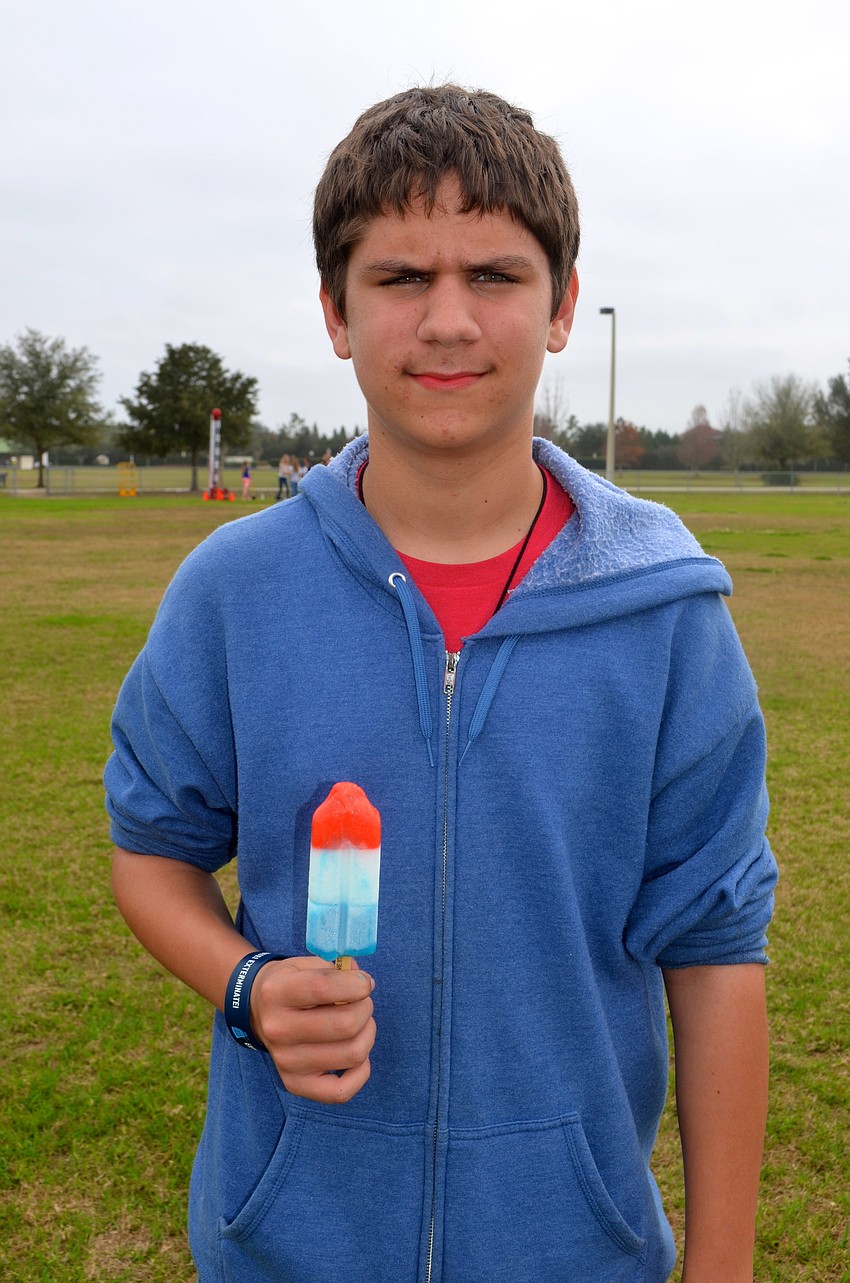 Bradley Davis, 12, enjoys a cold treat.